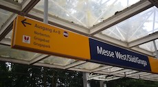 Messe West station sign